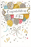 In this image, a sleek congratulations card stands upright against a neutral background, its design turning the front surface into a scene of gentle, sparkling celebration that feels right at home in New Eltham. The focus is a bouquet of illustrated balloons gathered in the upper and central part of the card, layered to suggest volume and softness. These balloons appear in a carefully chosen palette of warm gold, cool silver, soft champagne, airy sky blue, tender blush pink and muted grey, each one embellished with subtle patterns of stars, fine glitter-like sprinkles and slender stripes that shimmer as though touched by evening light over local gardens. From the base of this floating bouquet, narrow ribbons in metallic gold and silver trail downward, curling in relaxed spirals that add rhythm and grace, reminiscent of the way a florist lets ribbon and foliage fall naturally from a celebratory bouquet. Cutting through the middle of the cluster is an elegant banner, gently arched and bordered with a fine metallic line. On it, the words "Congratulations To You" are rendered in sweeping cursive script, giving the message a feeling of personal sincerity and quiet pride, perfect for acknowledging hard work, new beginnings or achievements celebrated in homes from New Eltham to nearby Eltham Park. The background remains a light, creamy shade, delicately sprinkled with small metallic stars, tiny dots and curling streamer motifs that capture the same spirit as confetti tossed after sharing good news. The lighting is even and soft, allowing the metallic details and glitter effects to stand out without harsh reflections. Overall, the card's composition is airy, polished and uplifting, a paper echo of a festive moment, ideal to accompany flowers when you want to send more than just words and truly celebrate someone's success.